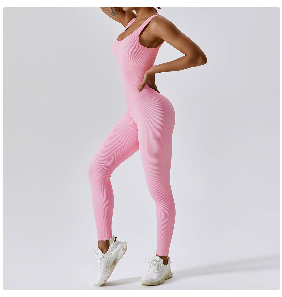 Woman wearing a pink, full-body LISS shapewear jumpsuit with a fitted, ribbed texture, designed for support and style.