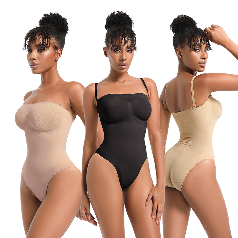 Woman modeling a strapless shapewear bodysuit thong in nude, black, and beige, showcasing the seamless, body-hugging fit and support. The image highlights the sculpting effect and versatility of the shapewear, perfect for enhancing the natural silhouette.